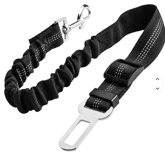 Wanderpaw adjustable dog car seat belt restraint clipped into a seat belt buckle